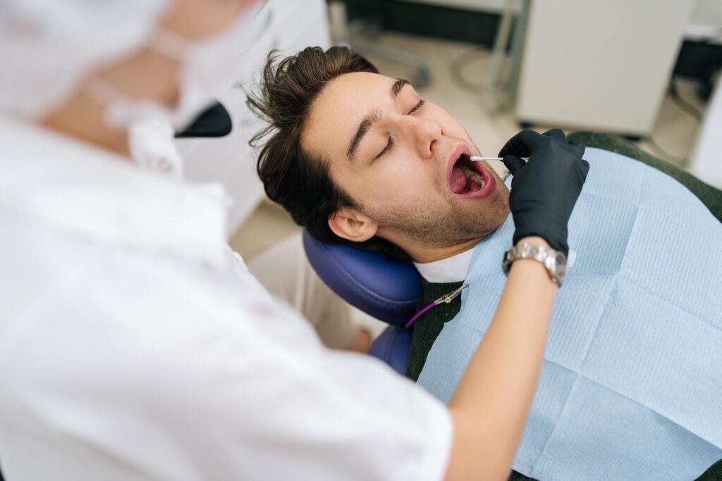 doctor taking saliva test